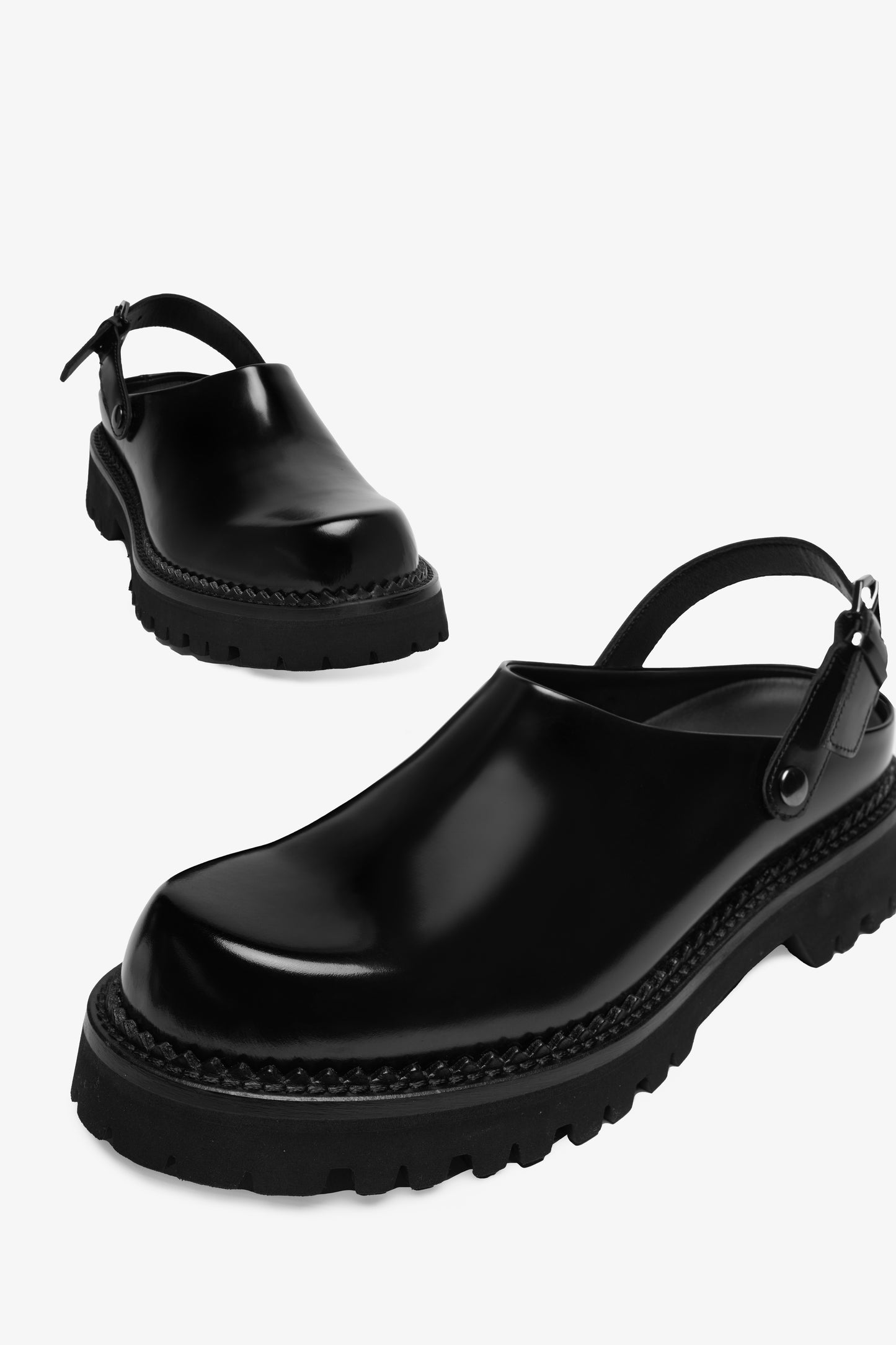 Berry black leather mule, angled view from above showing the toe and side