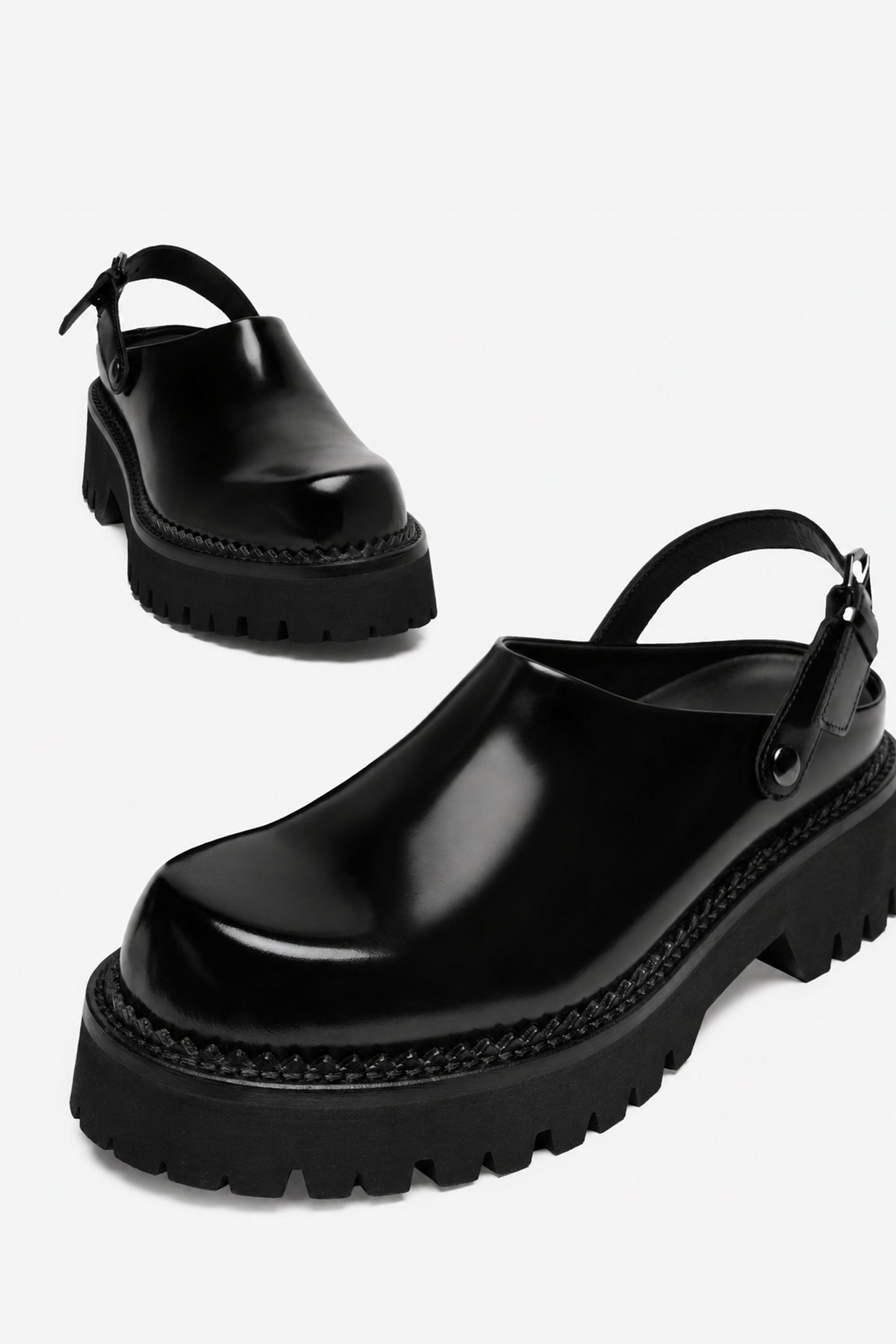 Berry black leather mule, angled view from above showing the toe and side