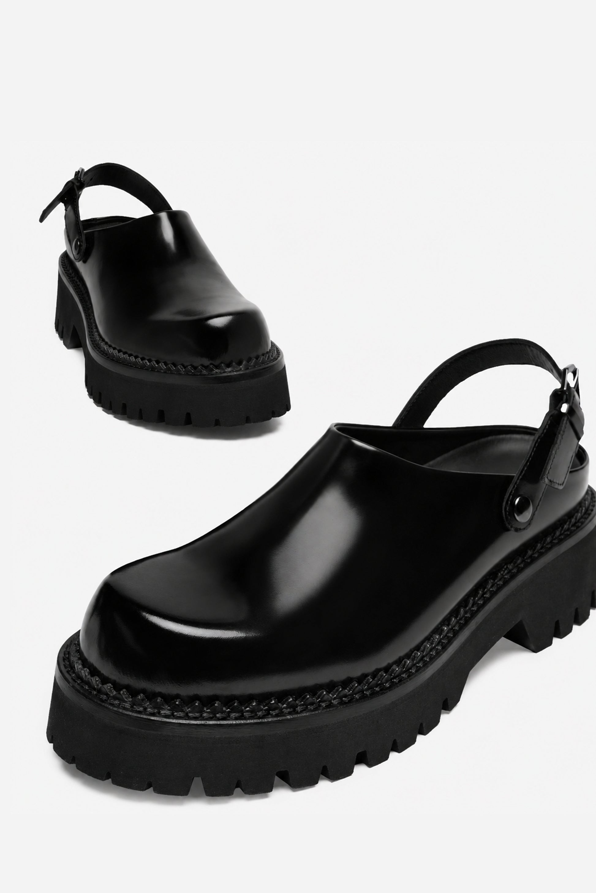 Berry black leather mule, angled view from above showing the toe and side