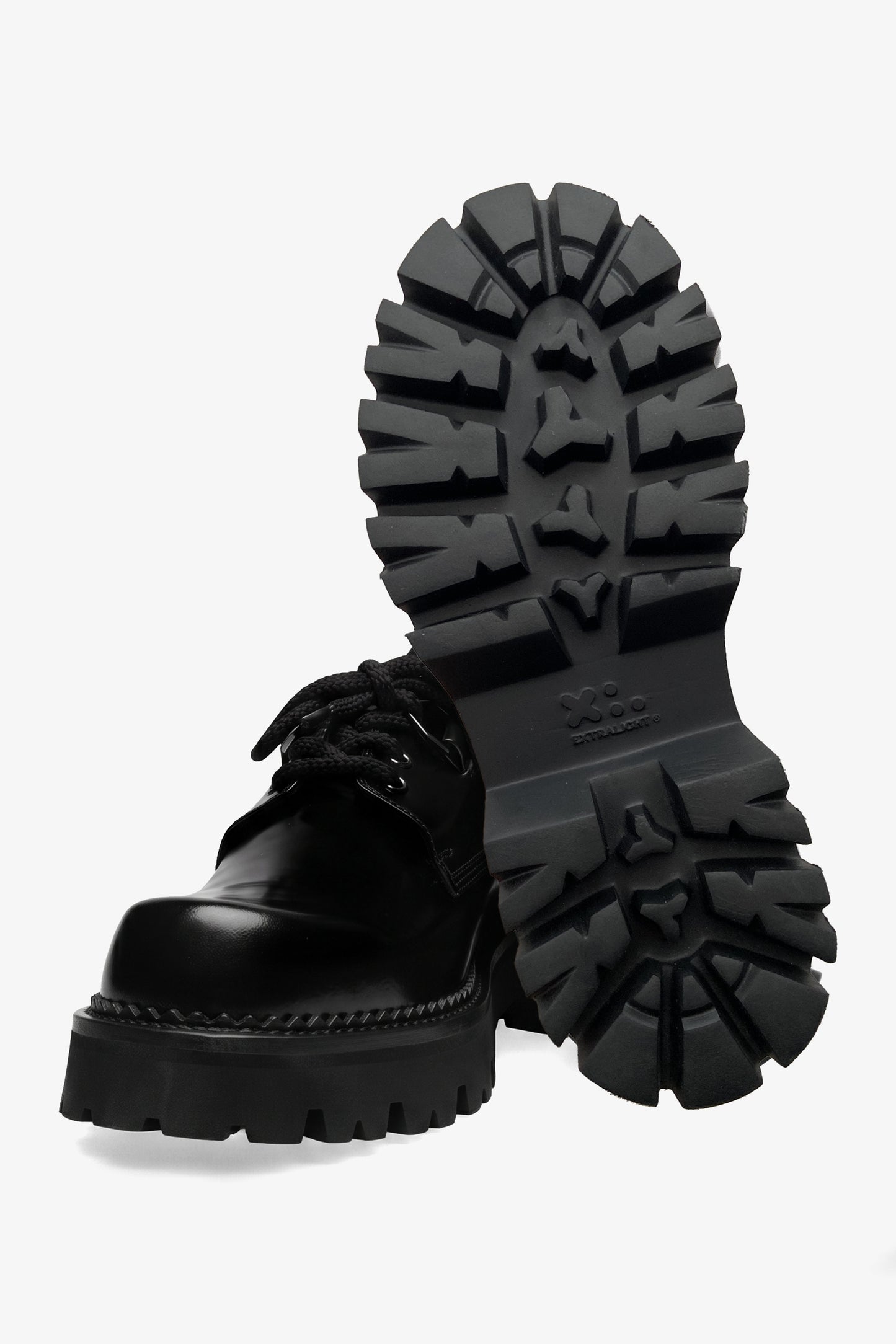 Curtis woman black leather derby shoe, front view with one shoe upright showing the outsole