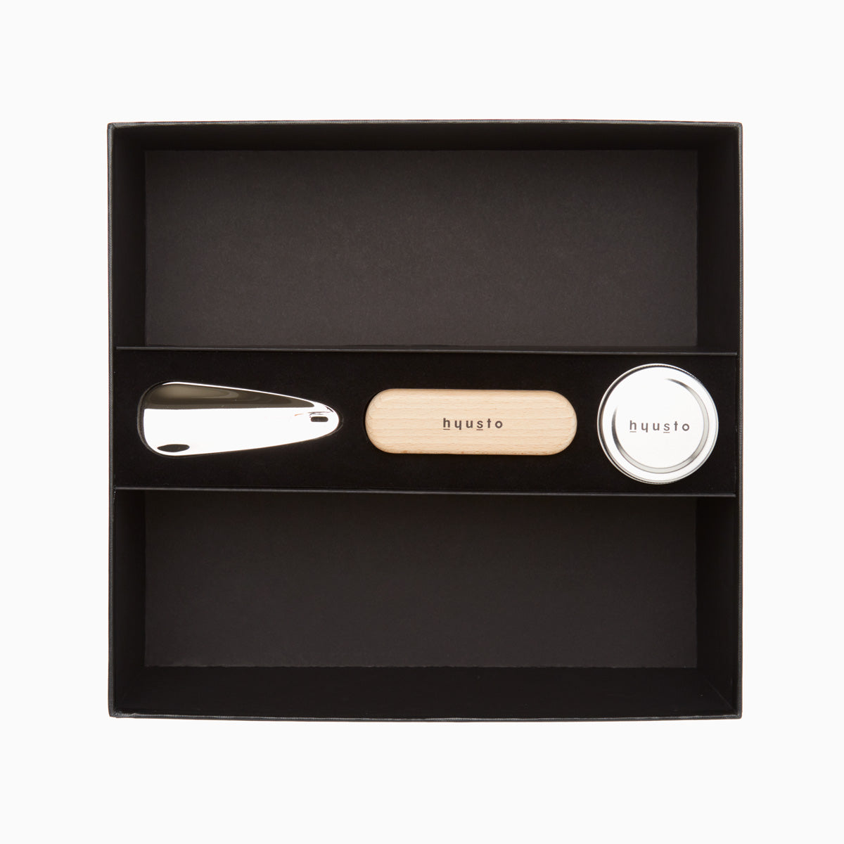 Hyusto Care and Maintenance box top view with shoehorn, brush and shoe cream 