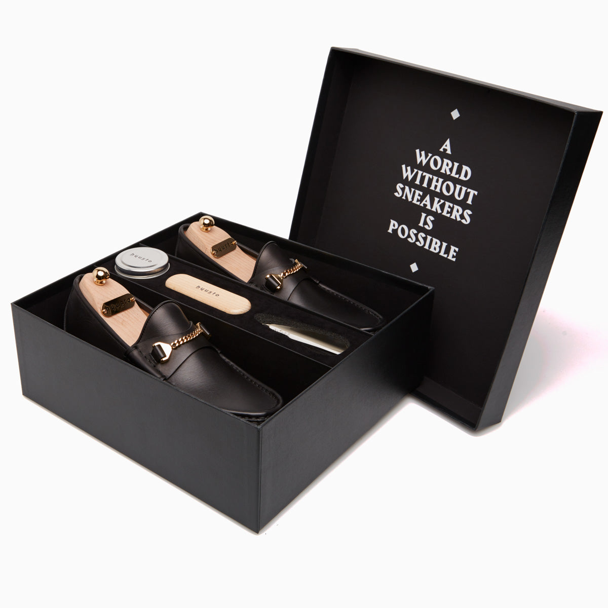 Hyusto Care and Maintenance box side view with shoes, wood Last, shoehorn, brush and shoe cream 